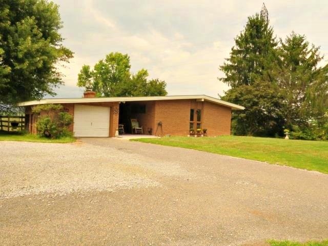 420 Cattle Scales Road Waynesboro, VA 22980 - Photo 1 of 43 a front view of house with yard and trees all around