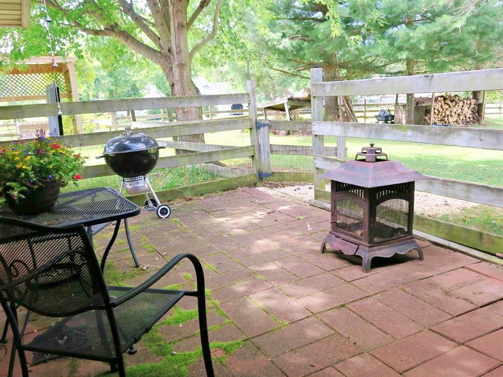 420 Cattle Scales Road Waynesboro, VA 22980 - Photo 10 of 43 a view of a chairs and table in backyard