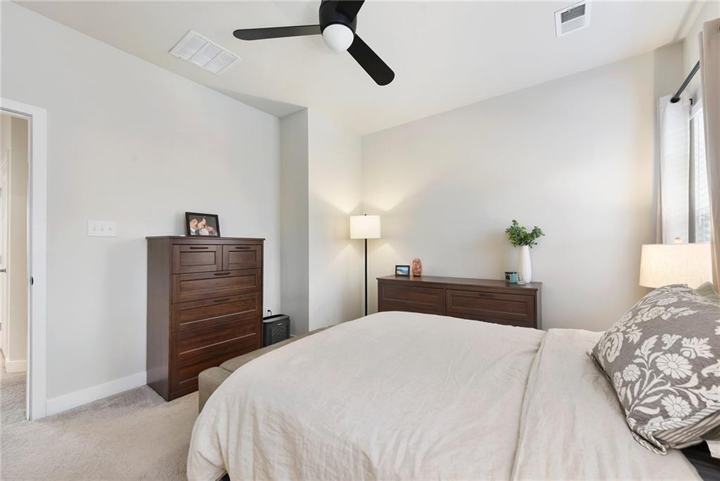 4302 Spruce Road Gibsonia, PA 15044 - Photo 14 of 24 a bedroom with a bed and a chandelier