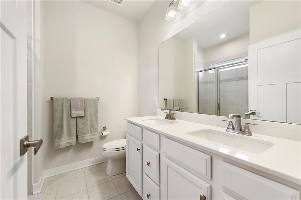 4302 Spruce Road Gibsonia, PA 15044 - Photo 15 of 24 a bathroom with a sink a toilet and shower