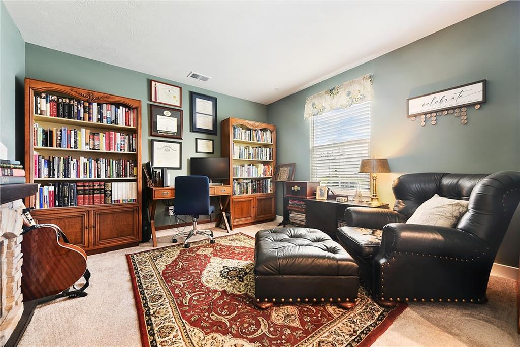 4302 Spruce Road Gibsonia, PA 15044 - Photo 20 of 24 a living room with furniture and a book shelf