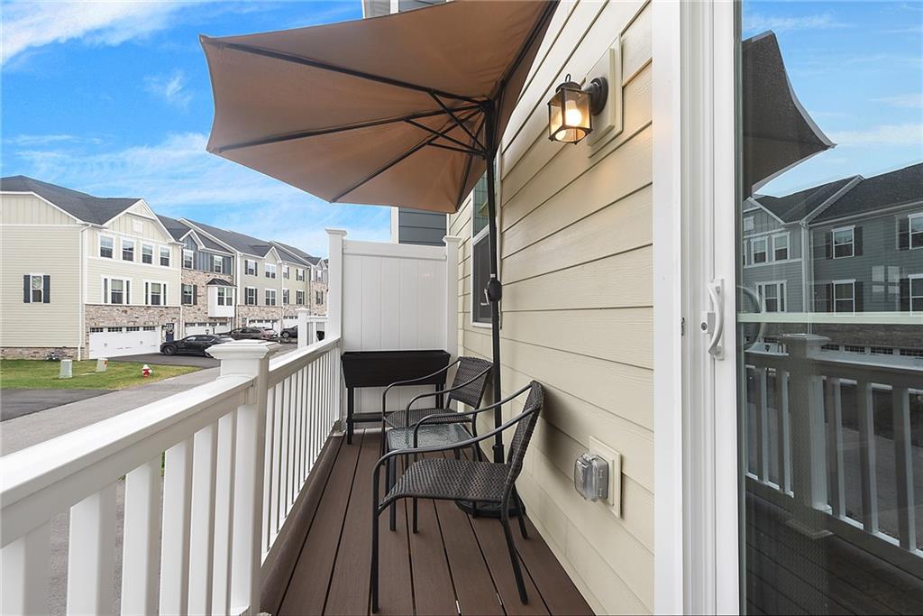 4302 Spruce Road Gibsonia, PA 15044 - Photo 23 of 24 a view of a balcony with chairs and a barbeque