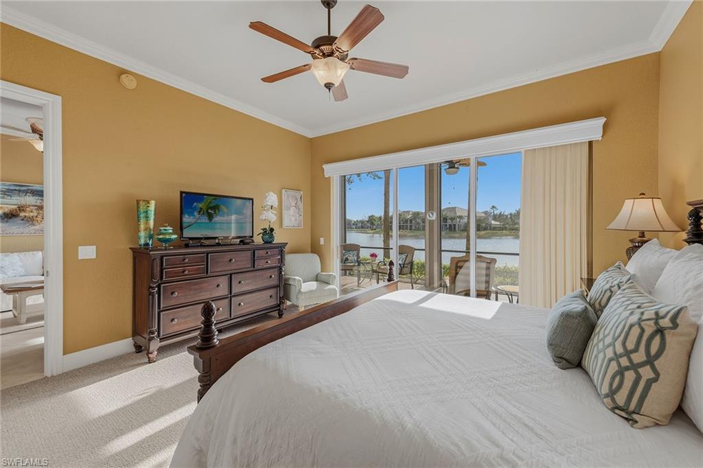 9233 Museo Circle, Unit 103 Naples, FL 34114 - Photo 11 of 49 a bed room with a bed and a television