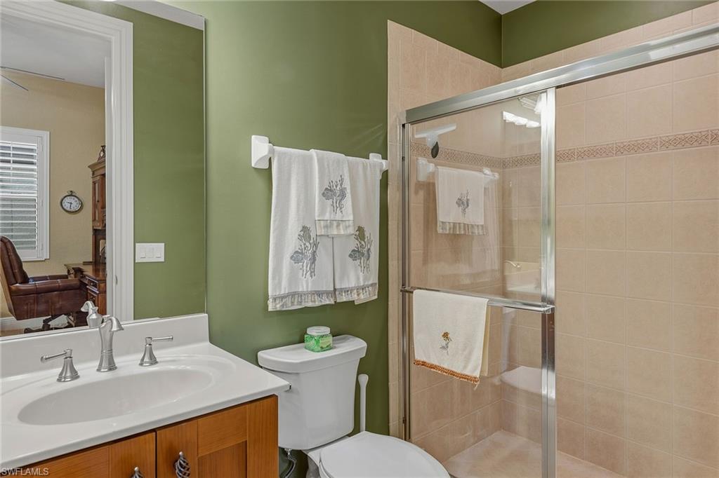 9233 Museo Circle, Unit 103 Naples, FL 34114 - Photo 19 of 49 a bathroom with a sink toilet and shower