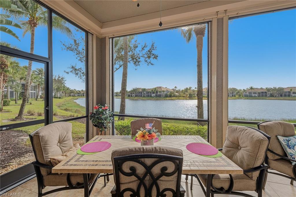 9233 Museo Circle, Unit 103 Naples, FL 34114 - Photo 22 of 49 a dining room with furniture a large window and a table