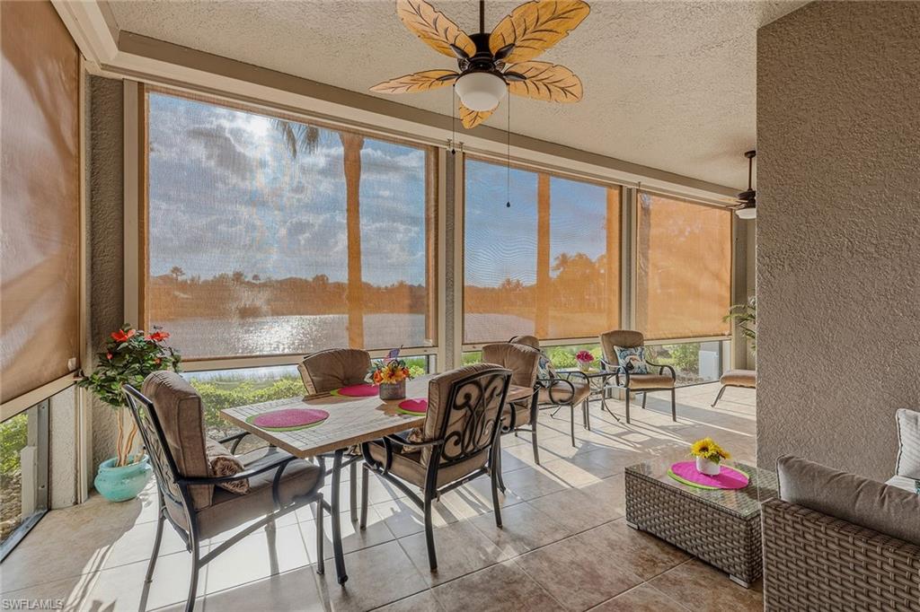 9233 Museo Circle, Unit 103 Naples, FL 34114 - Photo 24 of 49 a living room with furniture and a large window