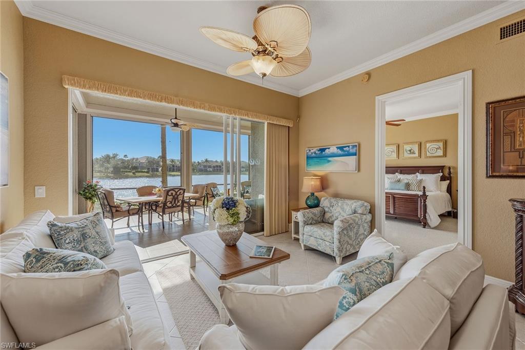 9233 Museo Circle, Unit 103 Naples, FL 34114 - Photo 3 of 49 a living room with furniture and a large window