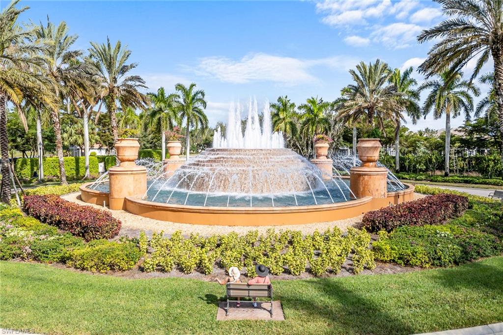 9233 Museo Circle, Unit 103 Naples, FL 34114 - Photo 31 of 49 a view of a swimming pool with a yard