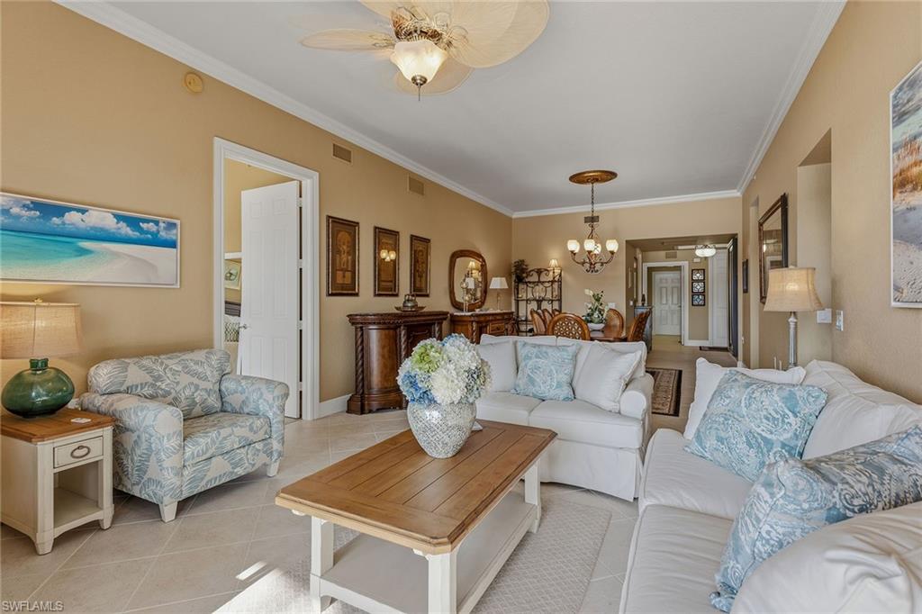 9233 Museo Circle, Unit 103 Naples, FL 34114 - Photo 4 of 49 a living room with furniture and kitchen view