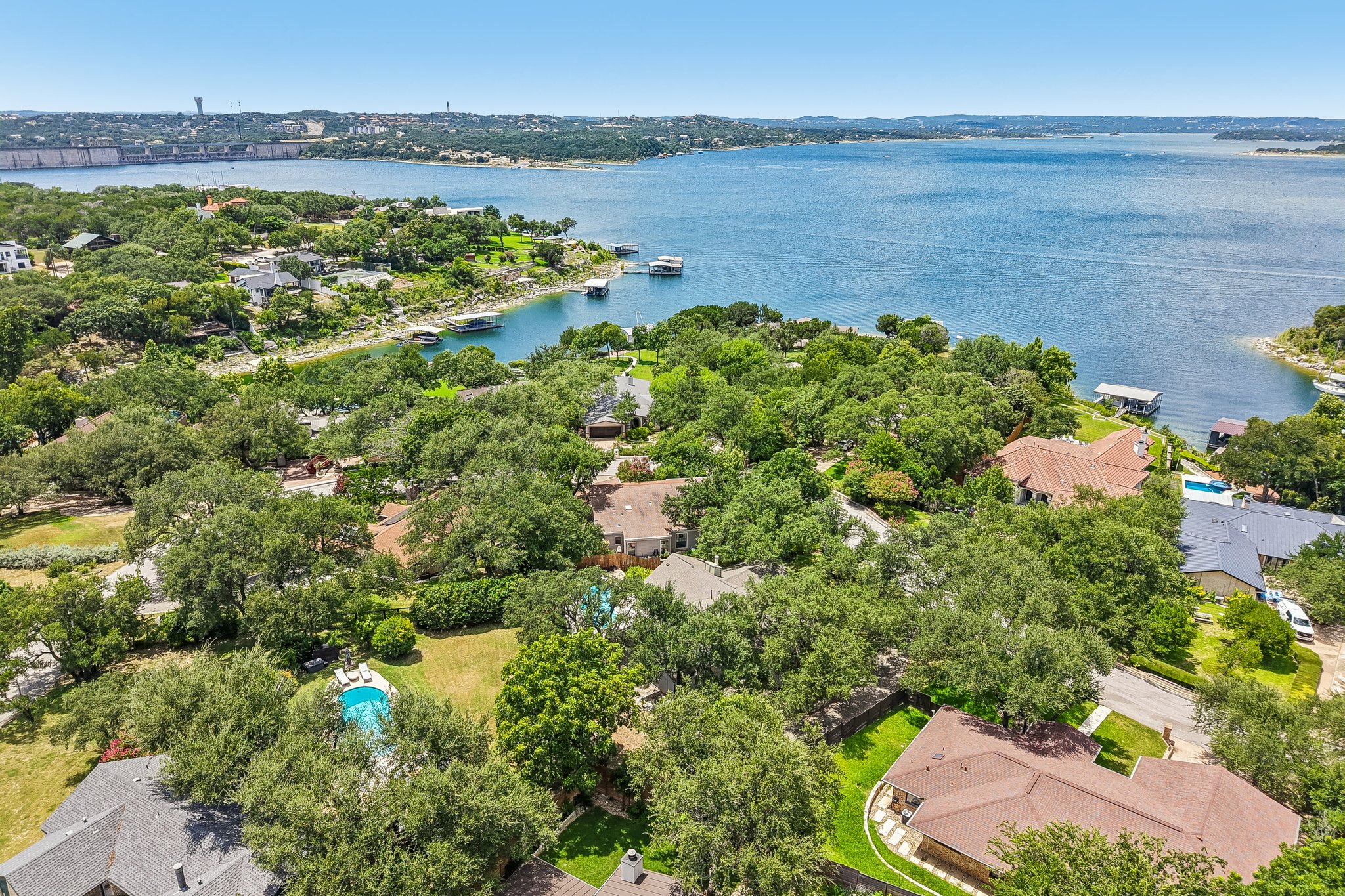 13101 Travis View Loop Austin, TX 78732 - Photo 17 of 27 Aerial view captures a sprawling neighborhood with direct lake access and private swimming pool.