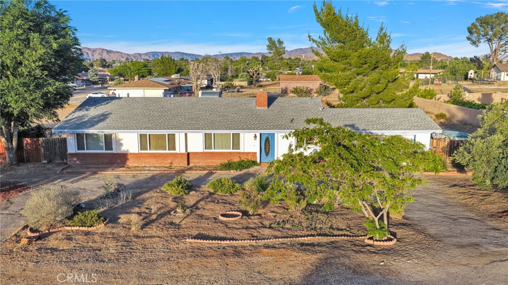 15177 Mendota Road North Apple Valley, CA 92307 - Photo 1 of 50 front view of a house with a yard
