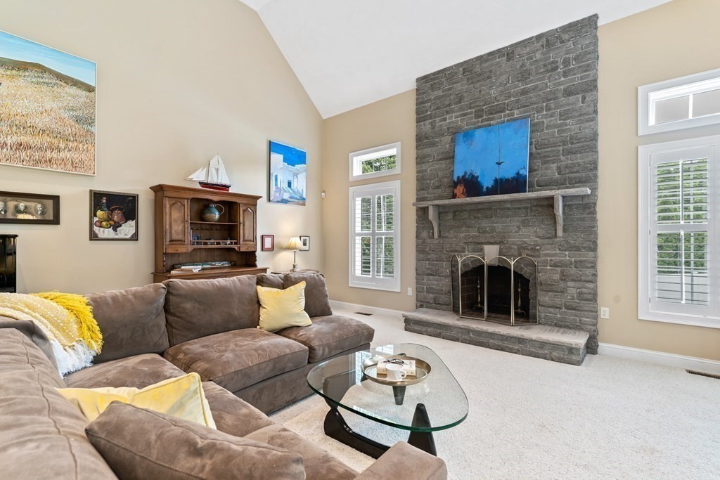 8 Boutwell Road Andover, MA 01810 - Photo 17 of 42 a living room with furniture and a fireplace