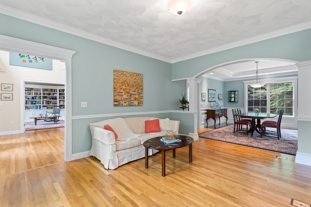 8 Boutwell Road Andover, MA 01810 - Photo 5 of 42 a living room with furniture and a wooden floor