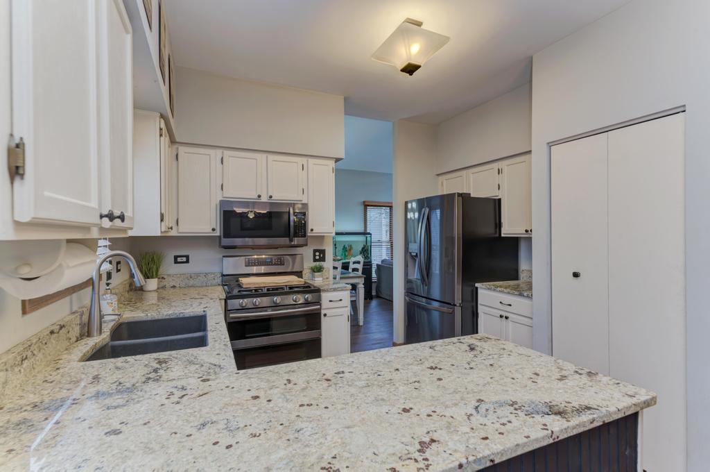 460 Springwood Lane Bolingbrook, IL 60440 - Photo 12 of 35 a kitchen with refrigerator and cabinets
