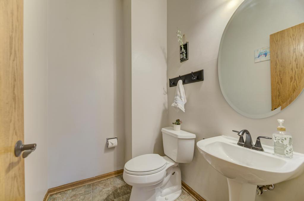 460 Springwood Lane Bolingbrook, IL 60440 - Photo 19 of 35 a bathroom with a sink toilet and a mirror