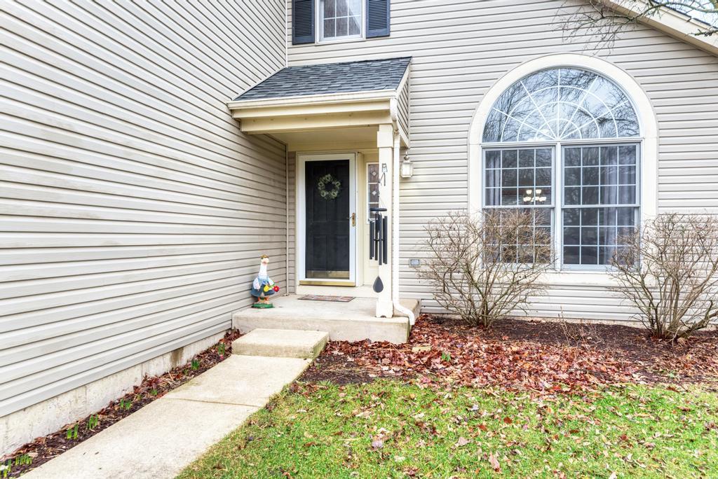 460 Springwood Lane Bolingbrook, IL 60440 - Photo 2 of 35 a front view of a house with a yard