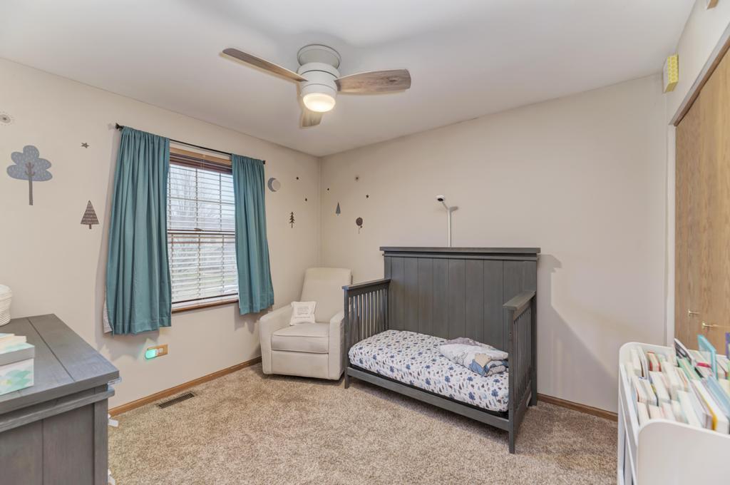 460 Springwood Lane Bolingbrook, IL 60440 - Photo 24 of 35 a living room with a couch and a window