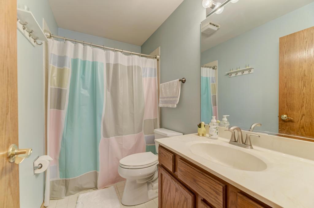 460 Springwood Lane Bolingbrook, IL 60440 - Photo 25 of 35 a bathroom with a granite countertop sink toilet and shower