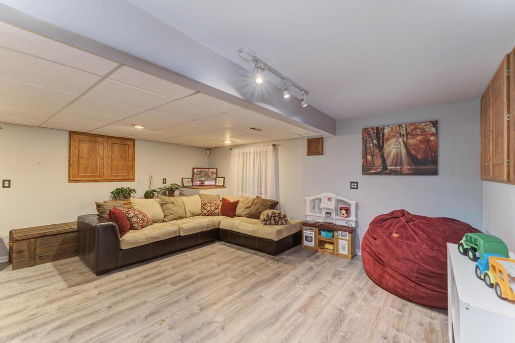 460 Springwood Lane Bolingbrook, IL 60440 - Photo 27 of 35 a living room with furniture and a wooden floor