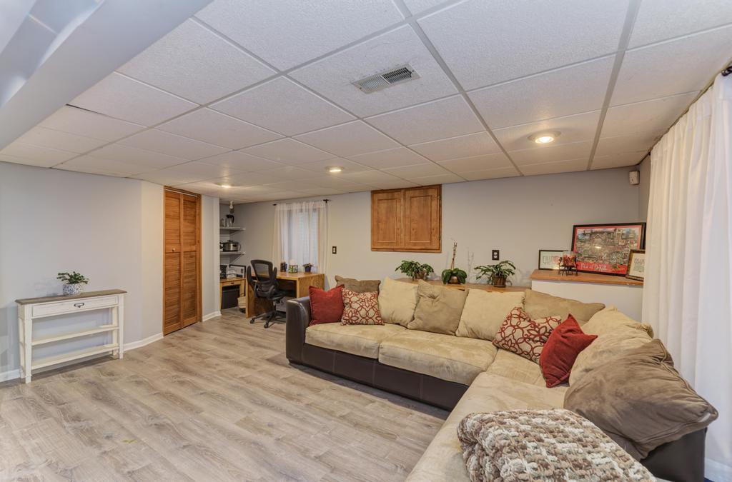 460 Springwood Lane Bolingbrook, IL 60440 - Photo 29 of 35 a living room with furniture and a wooden floor