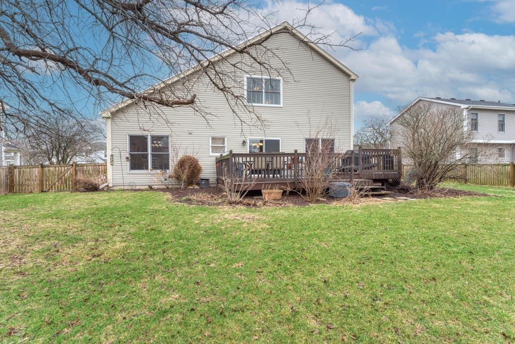 460 Springwood Lane Bolingbrook, IL 60440 - Photo 33 of 35 a backyard of a house with table and chairs