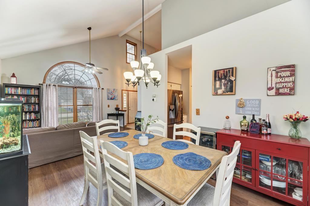460 Springwood Lane Bolingbrook, IL 60440 - Photo 9 of 35 a view of a dining room with furniture a rug and wooden floor