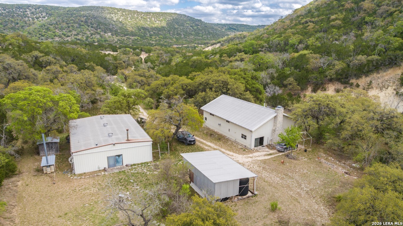 3655 North Seco Creek Road Medina, TX 78055 - Photo 1 of 45 an aerial view of a house with a yard