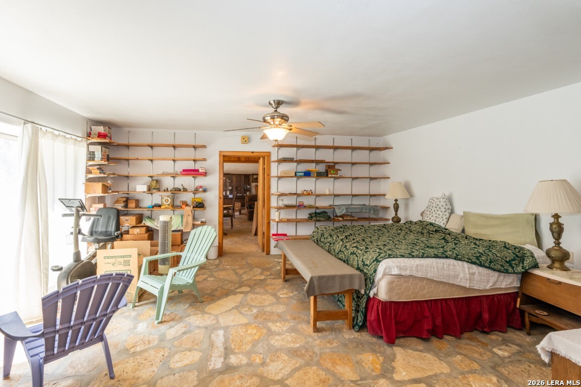 3655 North Seco Creek Road Medina, TX 78055 - Photo 23 of 45 a room with furniture and a chandelier