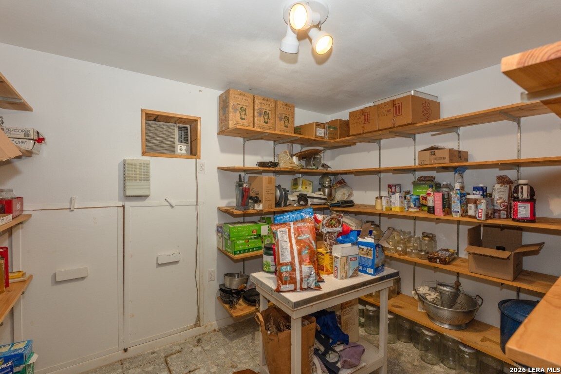 3655 North Seco Creek Road Medina, TX 78055 - Photo 28 of 45 a view of a room with racks and a shelf