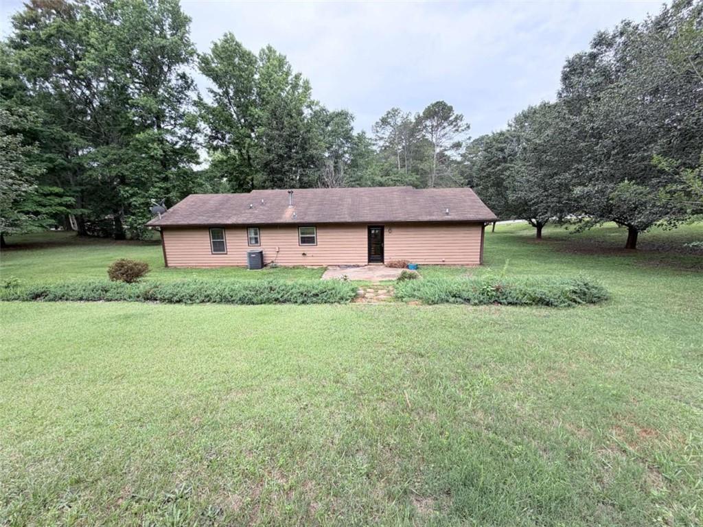 185 Roberts Road Covington, GA 30016 - Photo 25 of 25 a aerial view of a house next to a big yard and large trees