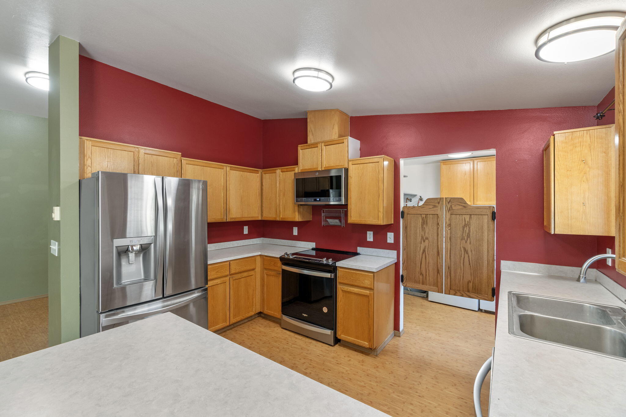 2630 Frontage Road Klamath Falls, OR 97601 - Photo 32 of 72 a kitchen with stainless steel appliances granite countertop a stove refrigerator and sink