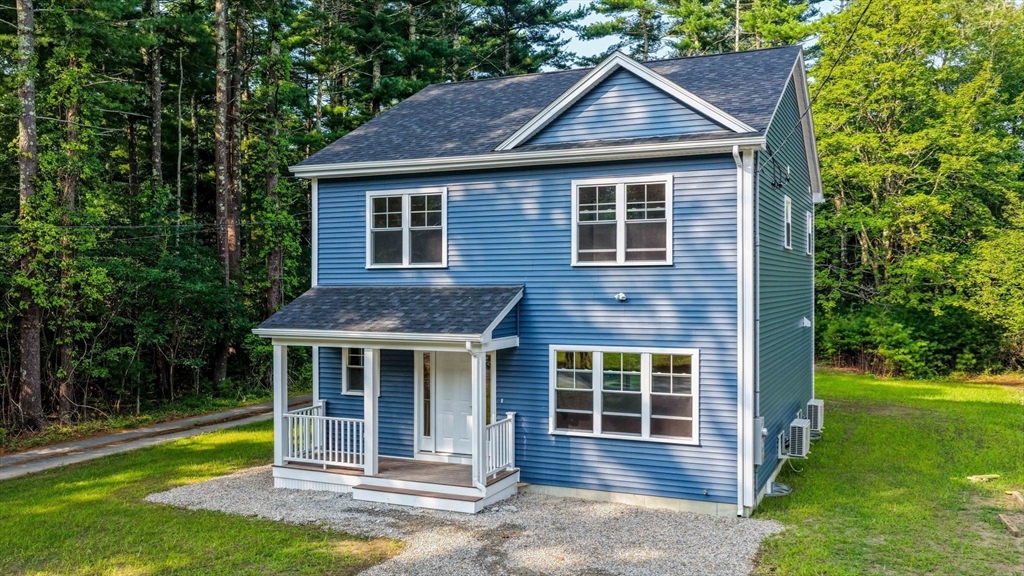 611 Delano Road Marion, MA 02738 - Photo 3 of 34 a front view of a house with a yard