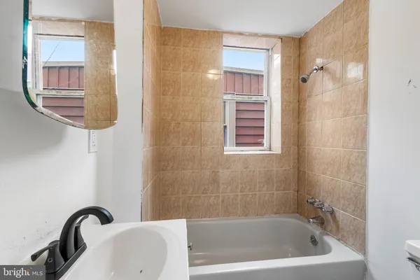 a bath tub sitting next to a bathroom