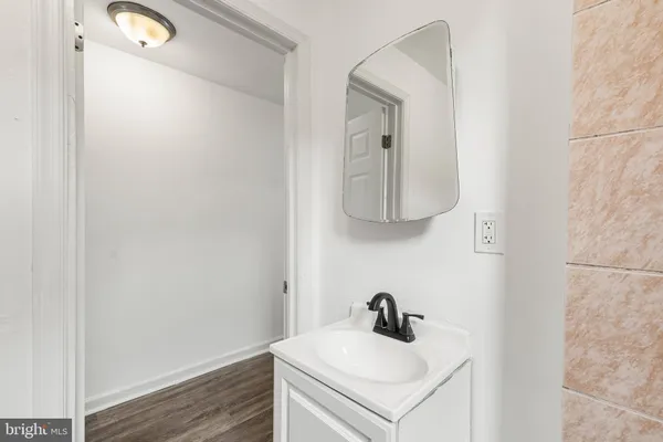 a bathroom with a sink and vanity