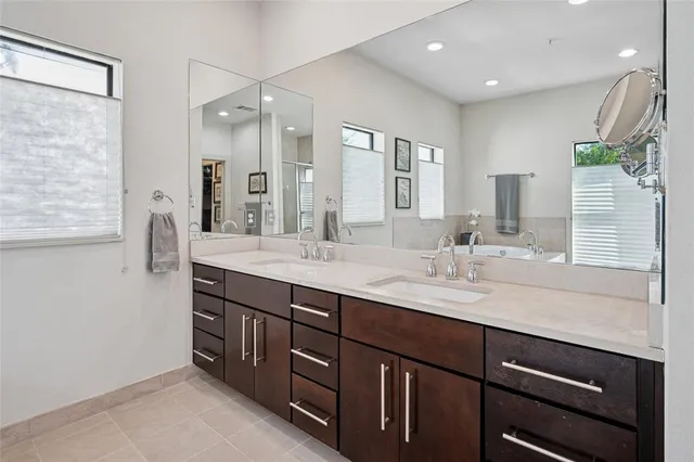 a bathroom with a granite countertop sink mirror and double