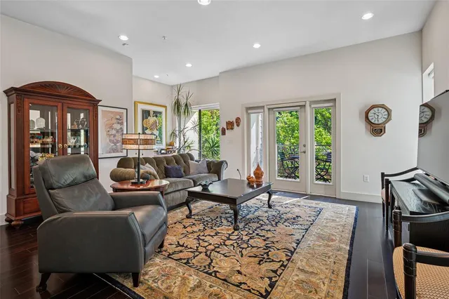 a living room with furniture fireplace and window