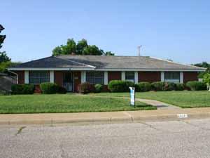 6017 Dreyfuss Road Amarillo, TX 79106 - Photo 1 of 1 a front view of a house with a yard