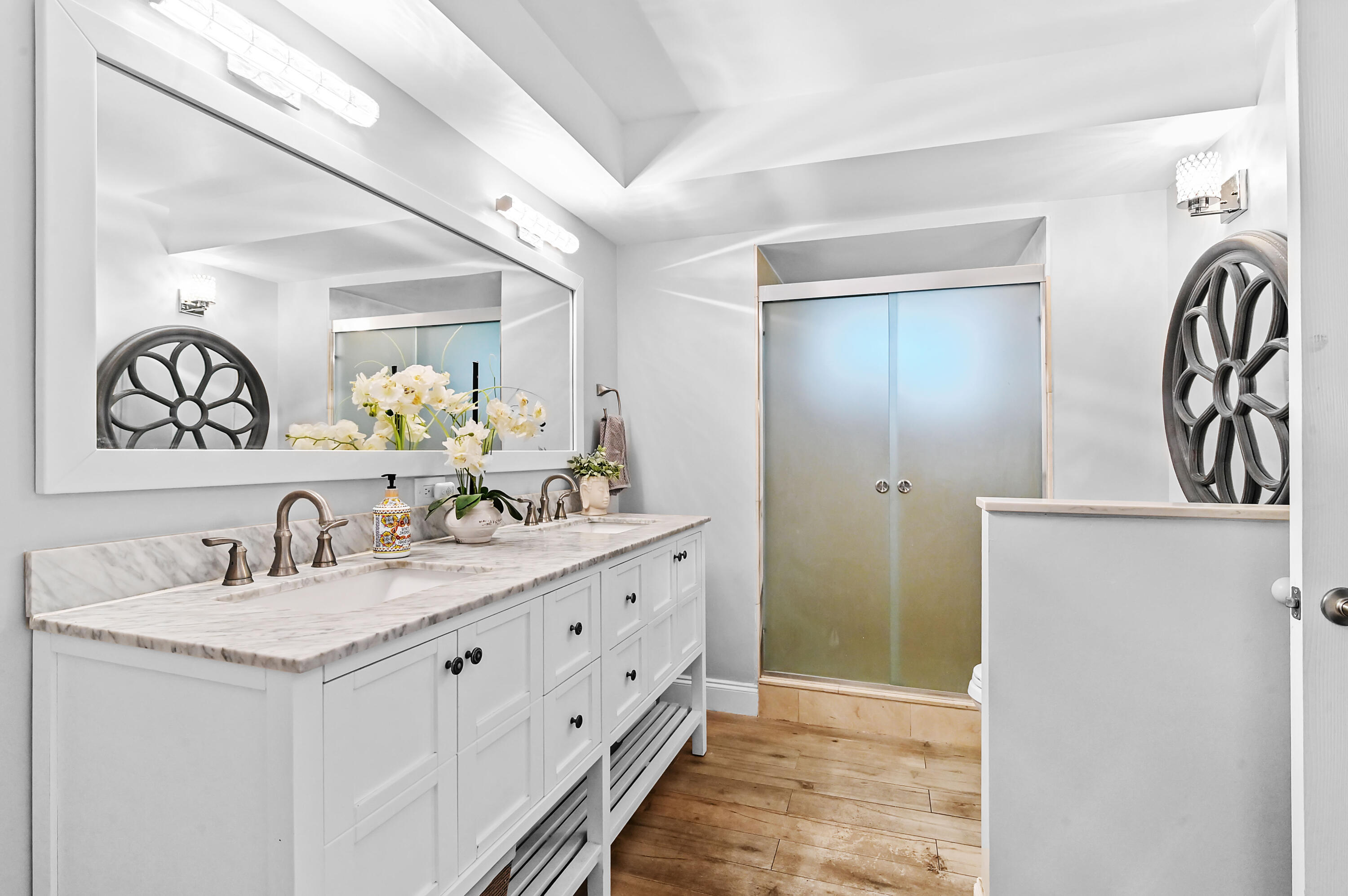 6400 Northwest 2nd Avenue, Unit 124 Boca Raton, FL 33487 - Photo 25 of 33 a bathroom with a double vanity sink and a mirror