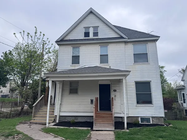 front view of a house with a yard
