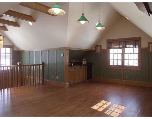 55 Sandy Pond Road Lincoln, MA 01773 - Photo 13 of 13 a view of an empty room with window and wooden floor