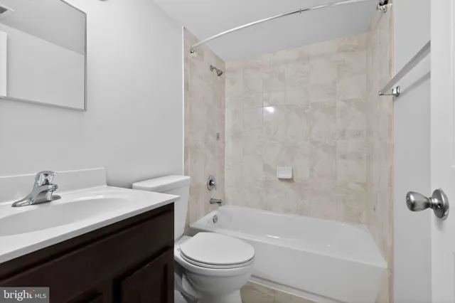 a bathroom with a sink a toilet and a bathtub