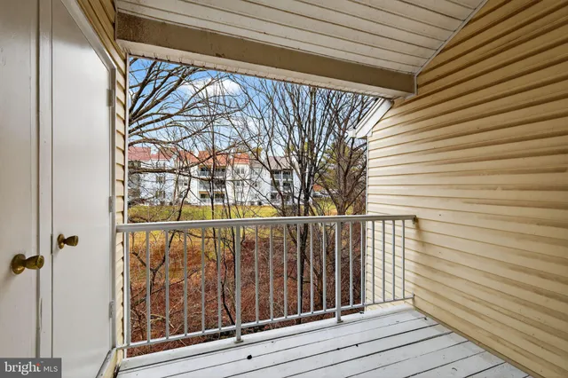 a view of balcony with wooden floor