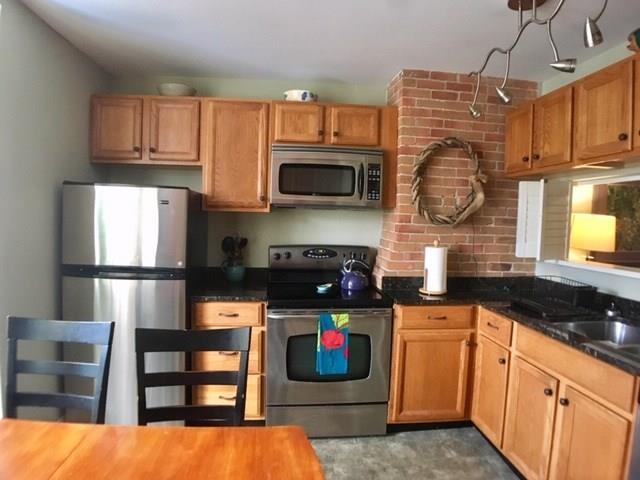 289 Spring Street, Unit 3 Portland, ME 04102 - Photo 8 of 21 Nice cabinetry with granite counters...