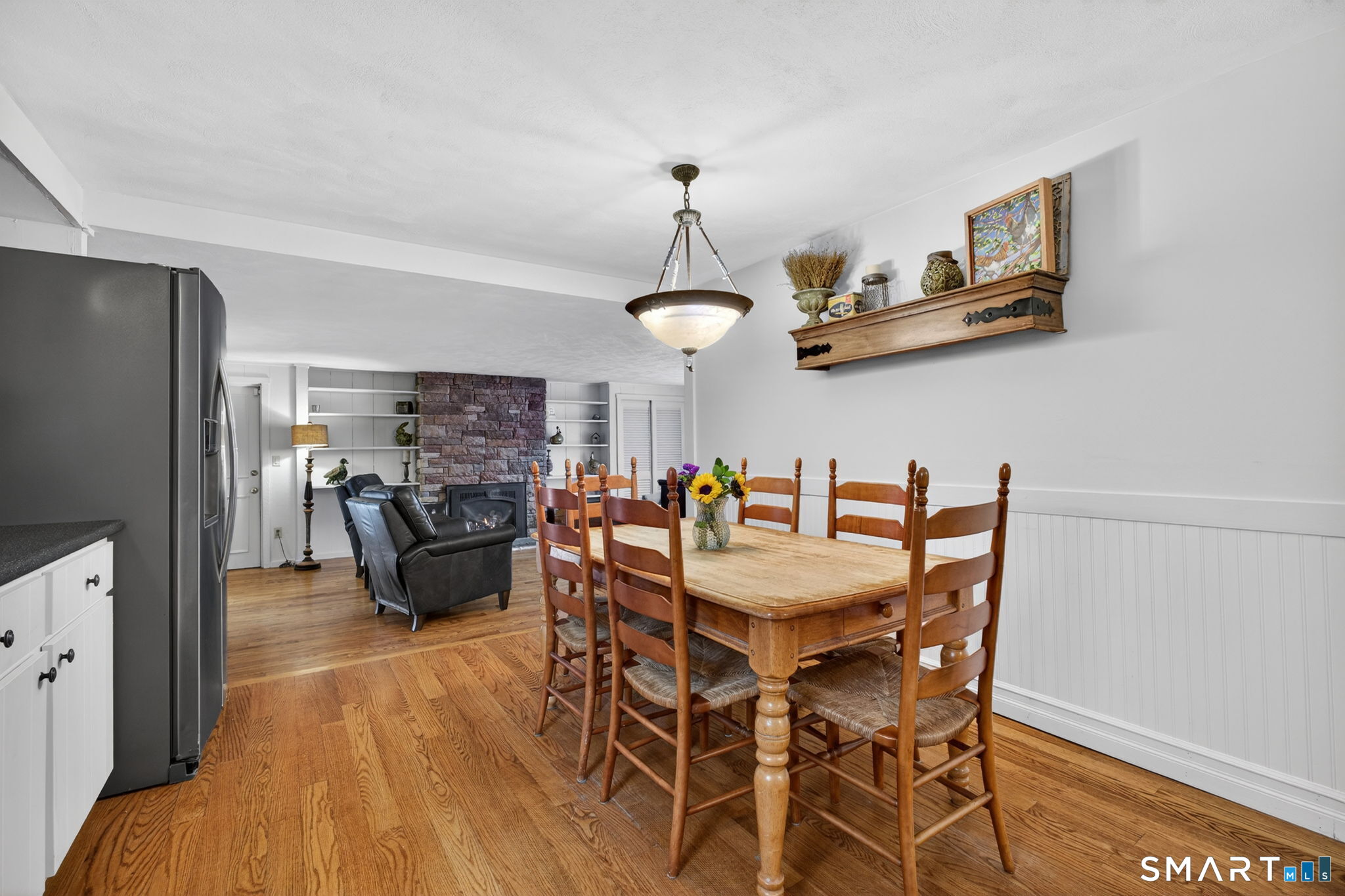 185 Ingham Hill Road Old Saybrook, CT 06475 - Photo 13 of 46 a view of a dining room with furniture and wooden floor