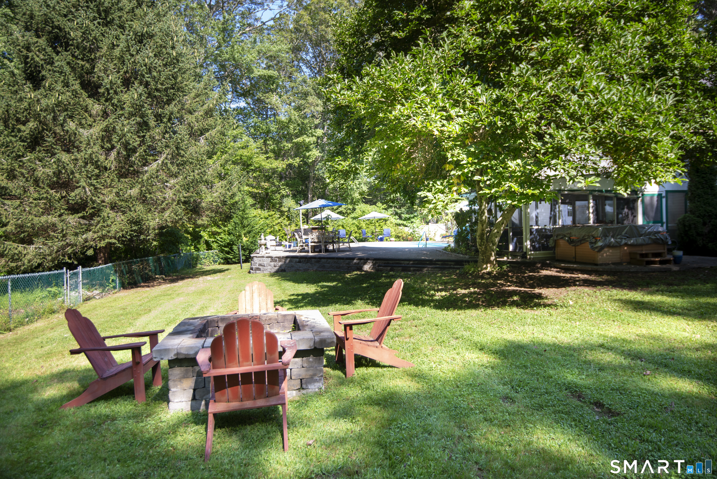 185 Ingham Hill Road Old Saybrook, CT 06475 - Photo 15 of 46 a view of backyard with swimming pool