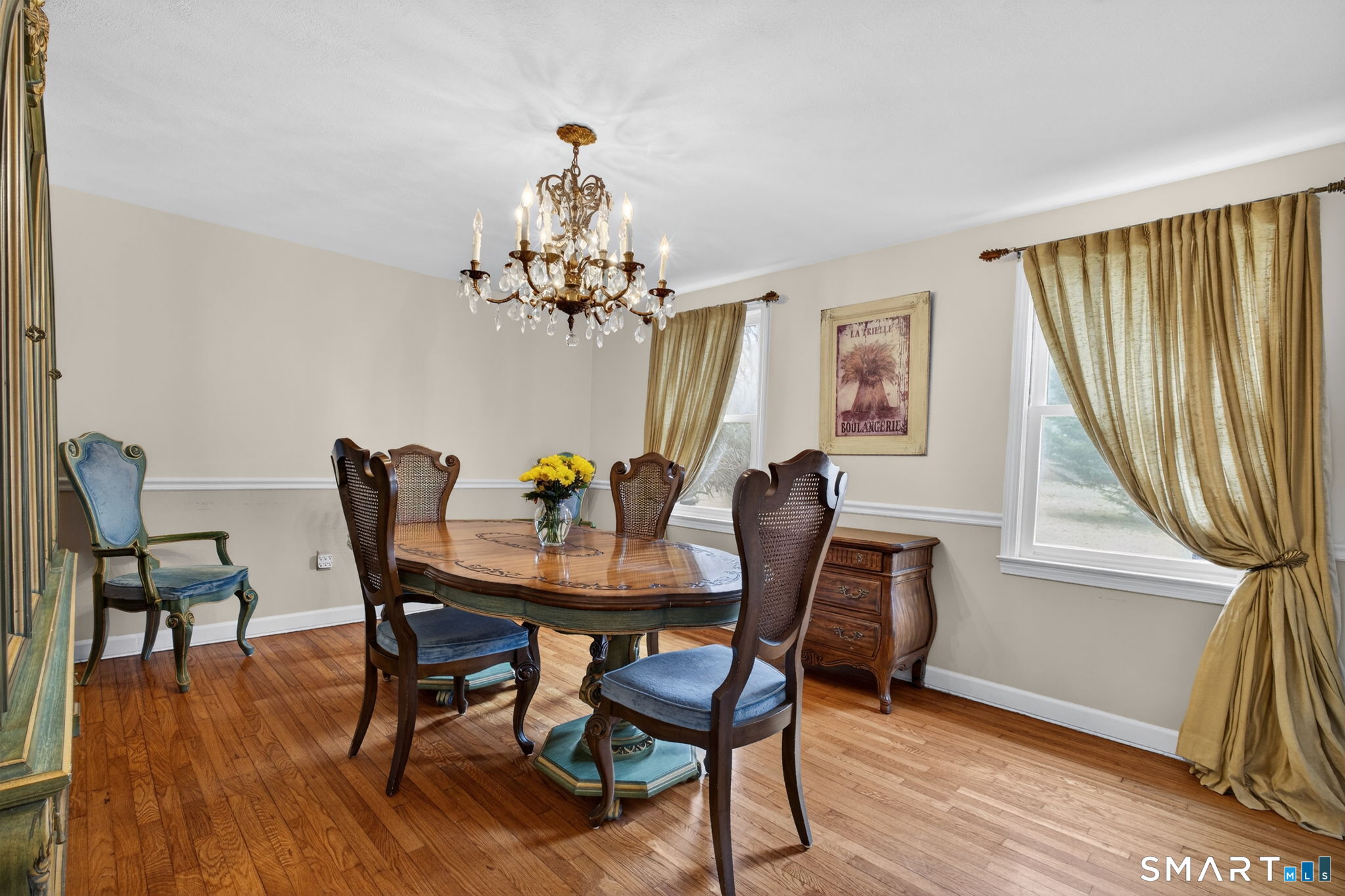 185 Ingham Hill Road Old Saybrook, CT 06475 - Photo 21 of 46 a view of a dining room with furniture and wooden floor