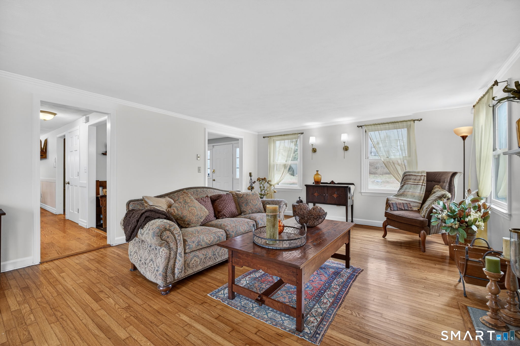 185 Ingham Hill Road Old Saybrook, CT 06475 - Photo 25 of 46 a living room with furniture and a wooden floor