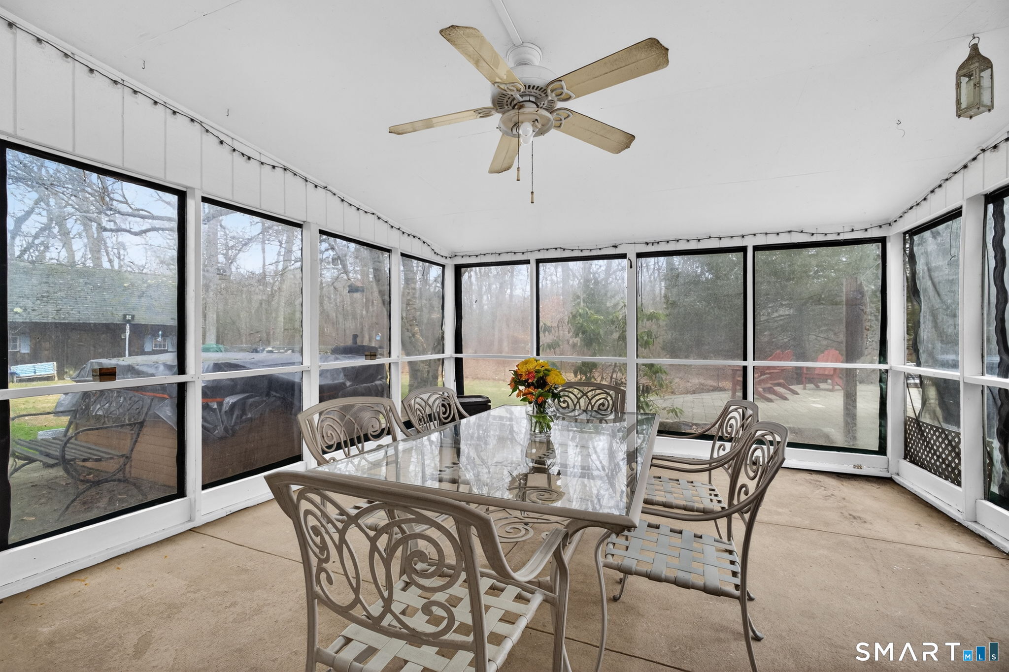 185 Ingham Hill Road Old Saybrook, CT 06475 - Photo 31 of 46 a dining room with furniture and a large window