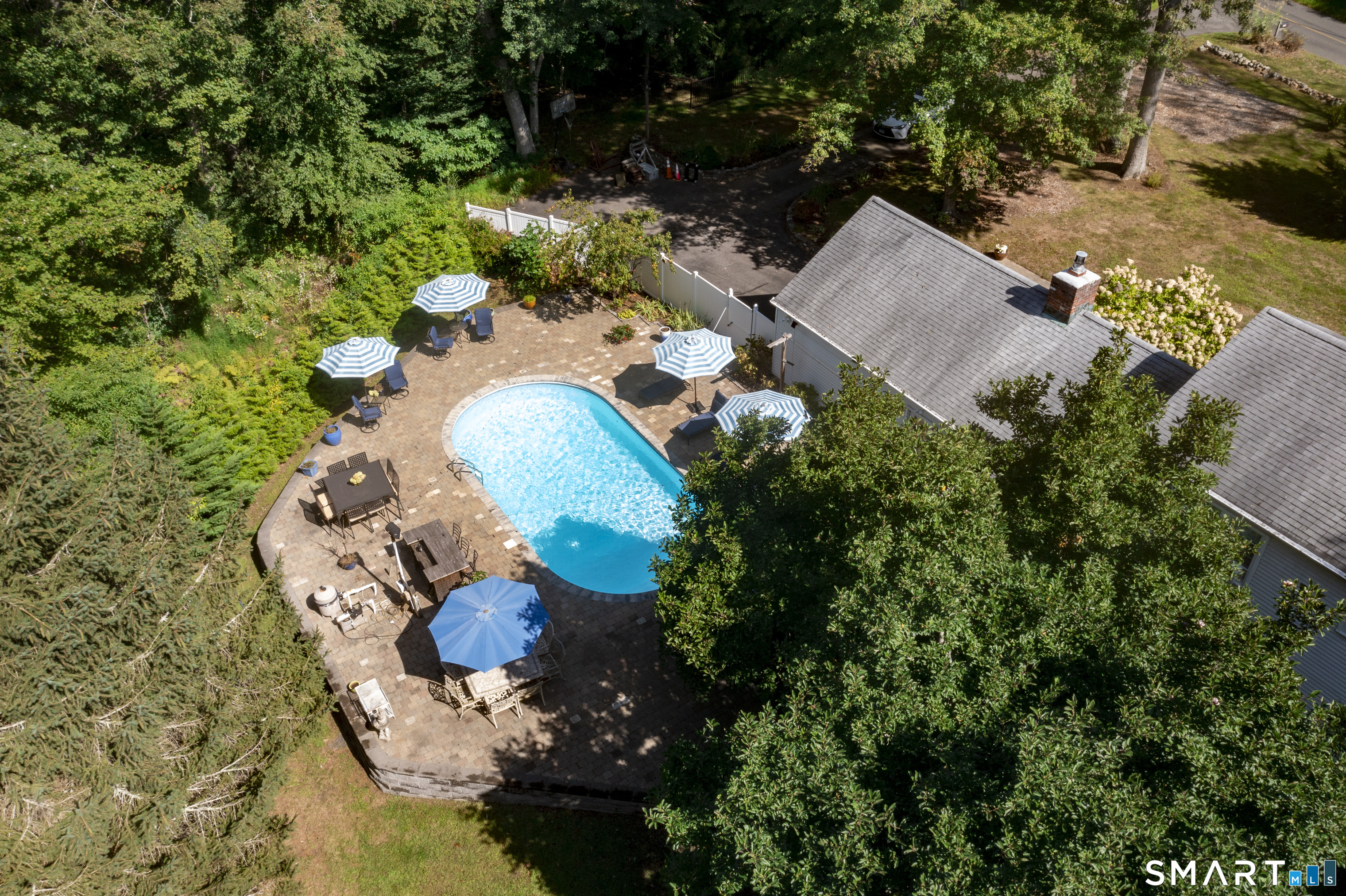 185 Ingham Hill Road Old Saybrook, CT 06475 - Photo 7 of 46 an aerial view of a house with a swimming pool yard and outdoor seating