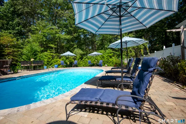 a view of a yard with furniture and backyard